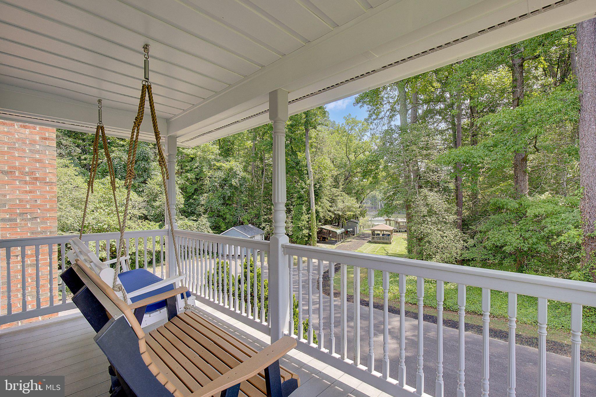 980 Apple Lane Solomons, MD 20629 - Photo 53 of 82 Serene porch with lush green views.