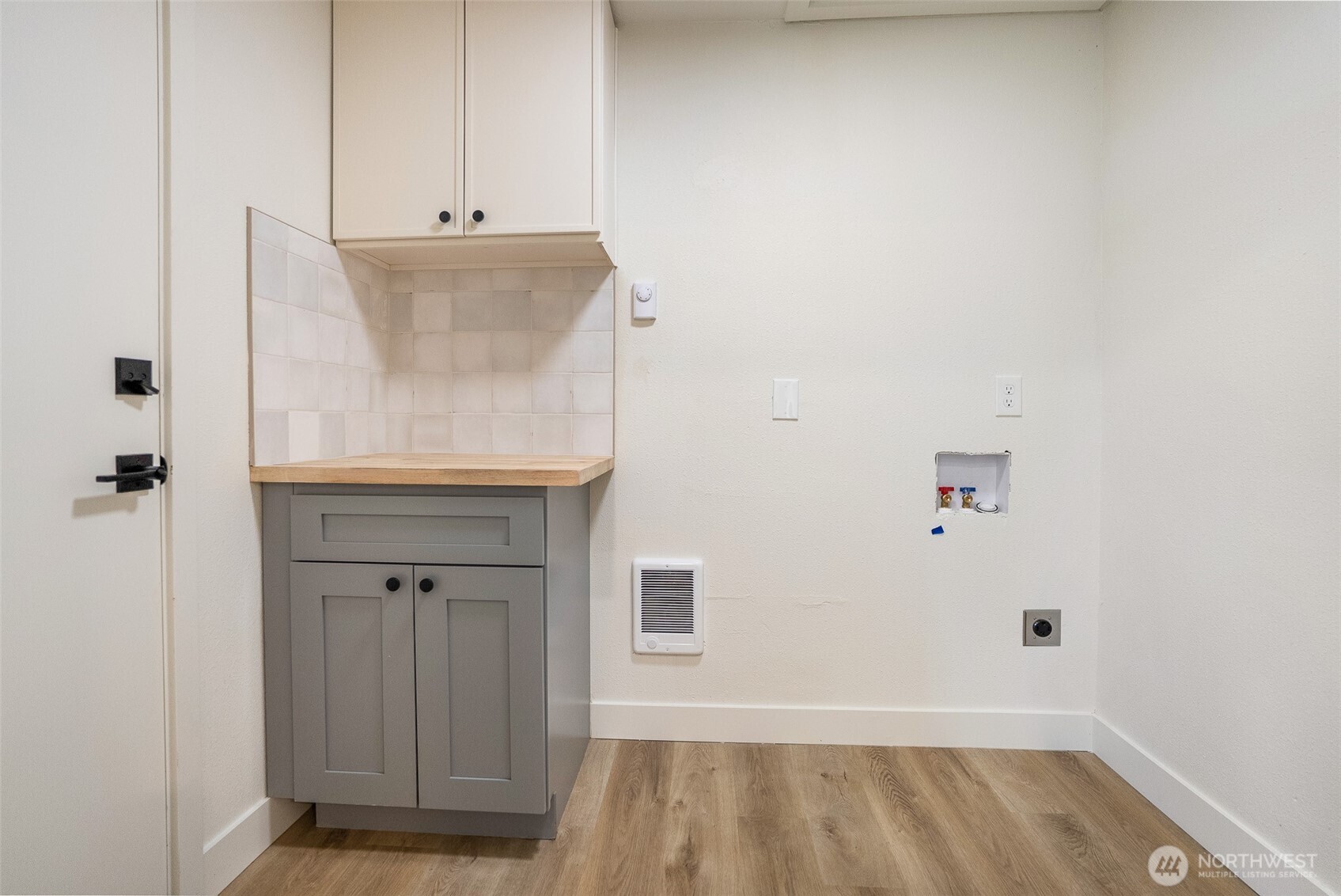 7934 20th Avenue Southwest Seattle, WA 98106 - Photo 12 of 20 a view of storage and utility room with wooden floor
