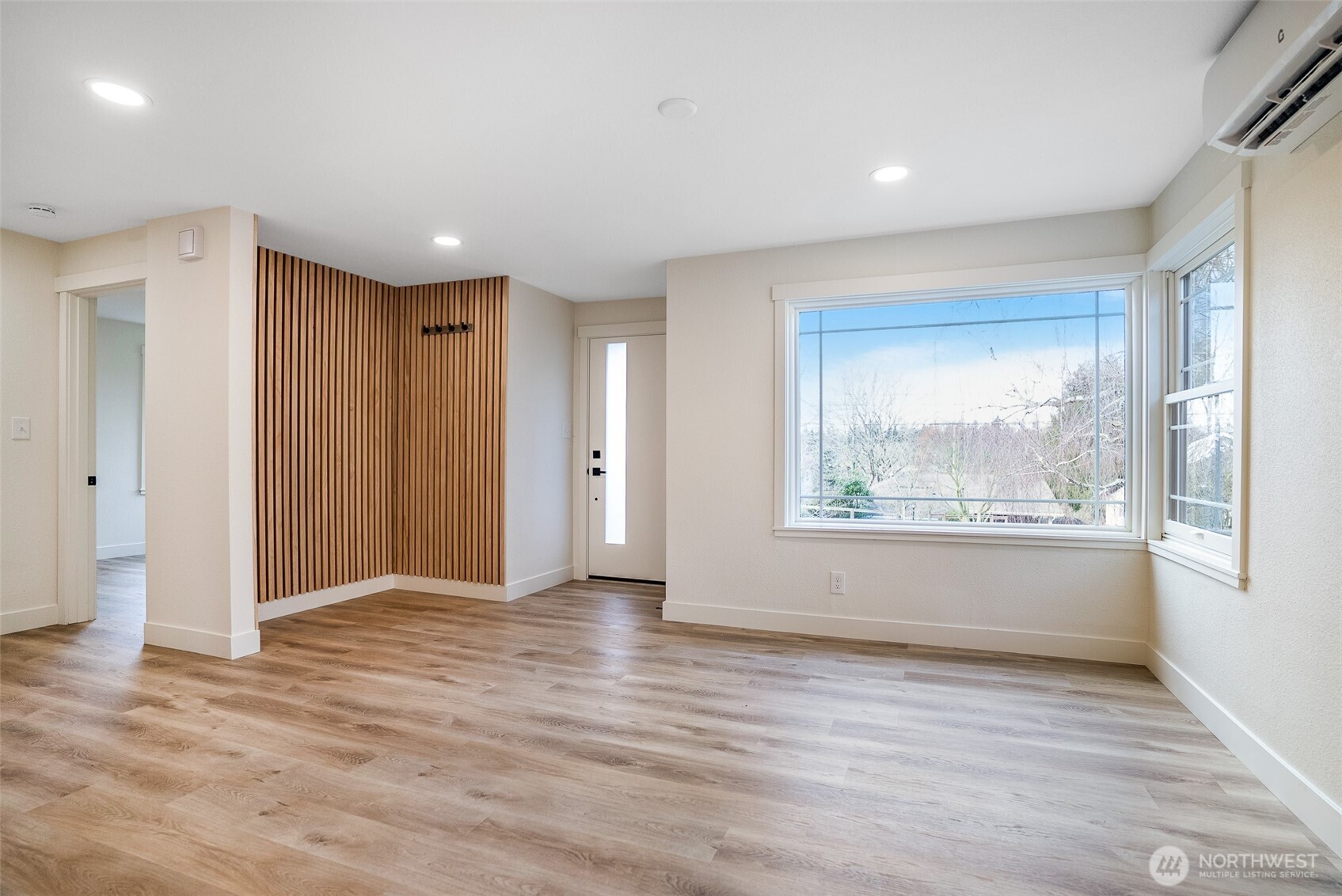 7934 20th Avenue Southwest Seattle, WA 98106 - Photo 13 of 20 an empty room with wooden floor and windows