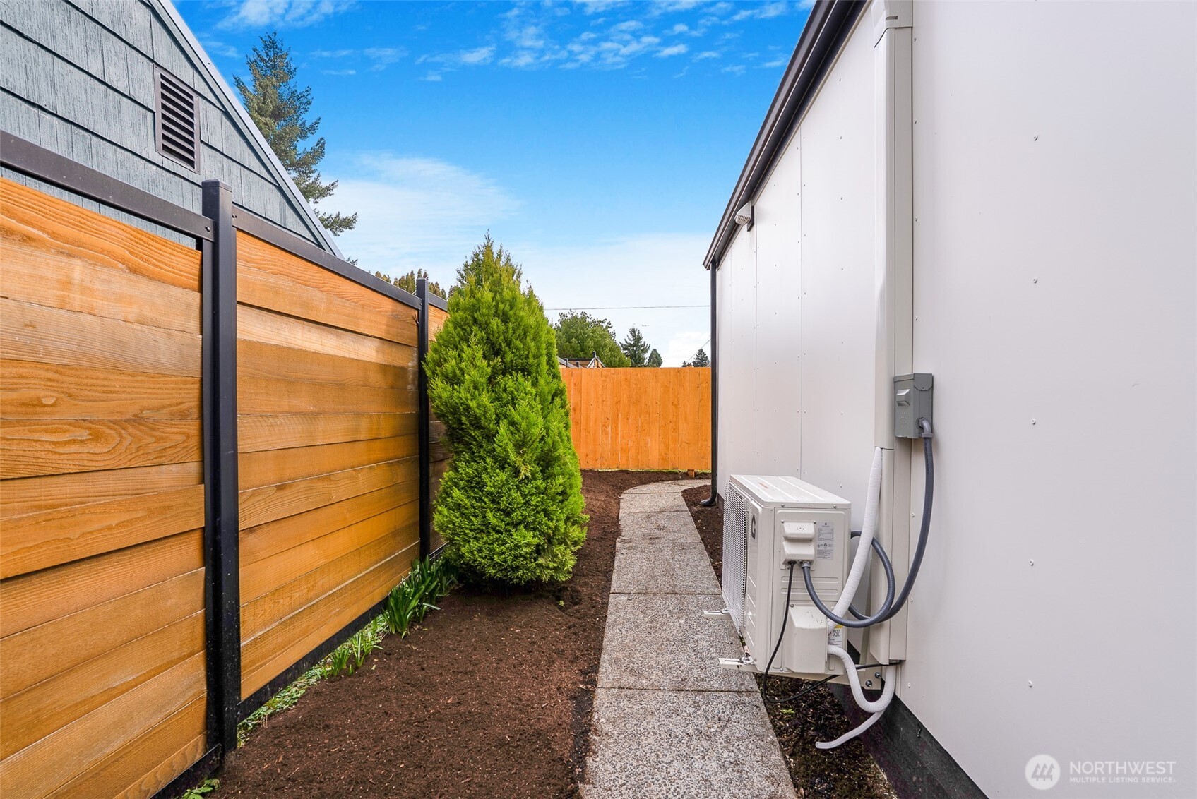 7934 20th Avenue Southwest Seattle, WA 98106 - Photo 16 of 20 a view of a staircase with two chairs and a potted plant