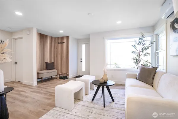 a living room with furniture and a large window