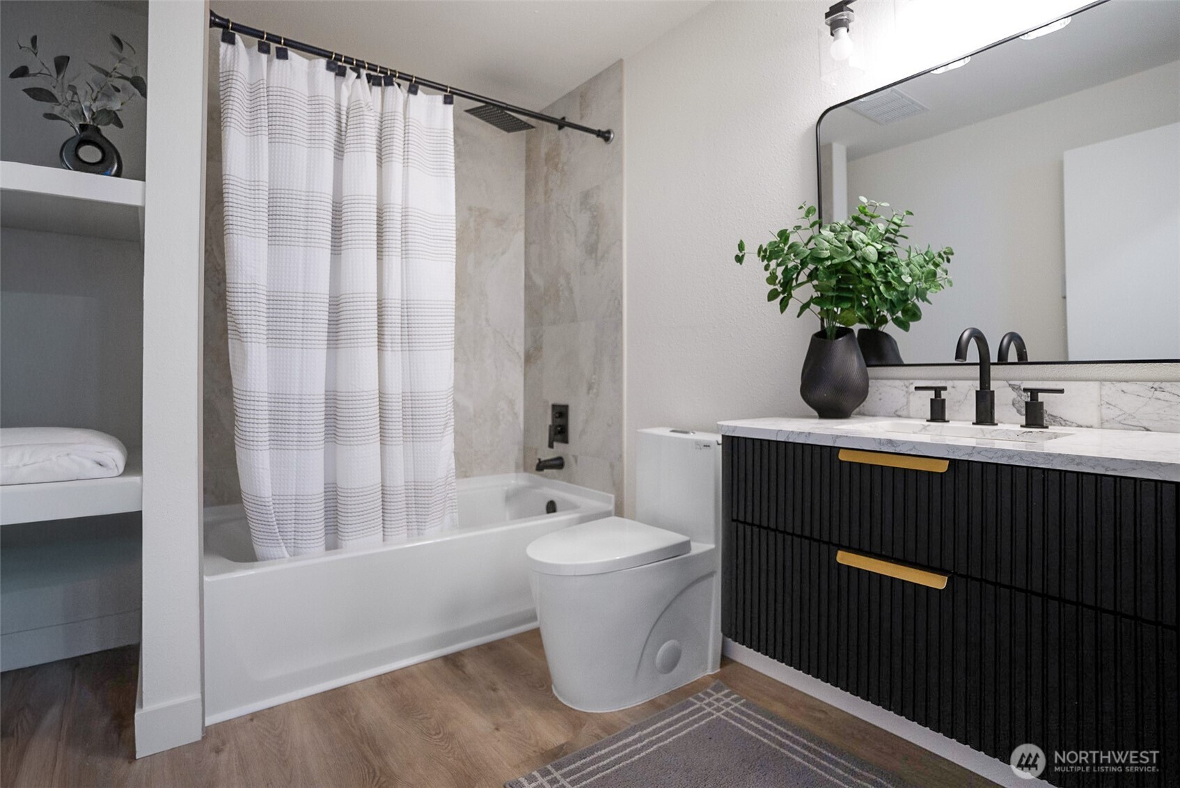7934 20th Avenue Southwest Seattle, WA 98106 - Photo 10 of 20 a bathroom with a sink toilet and shower