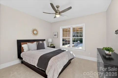 a bedroom with a bed and window