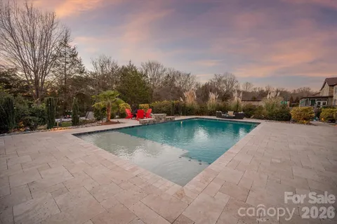 a view of a park with large trees