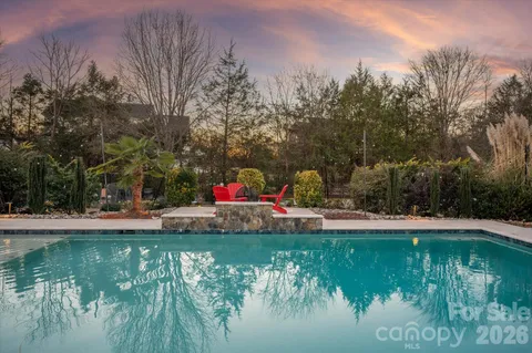 a view of a swimming pool with a yard