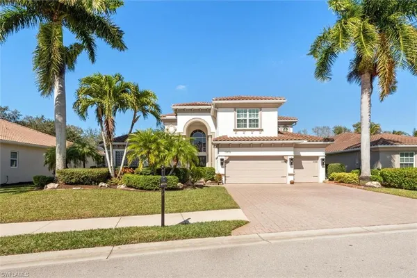 a house with palm tree in front of it