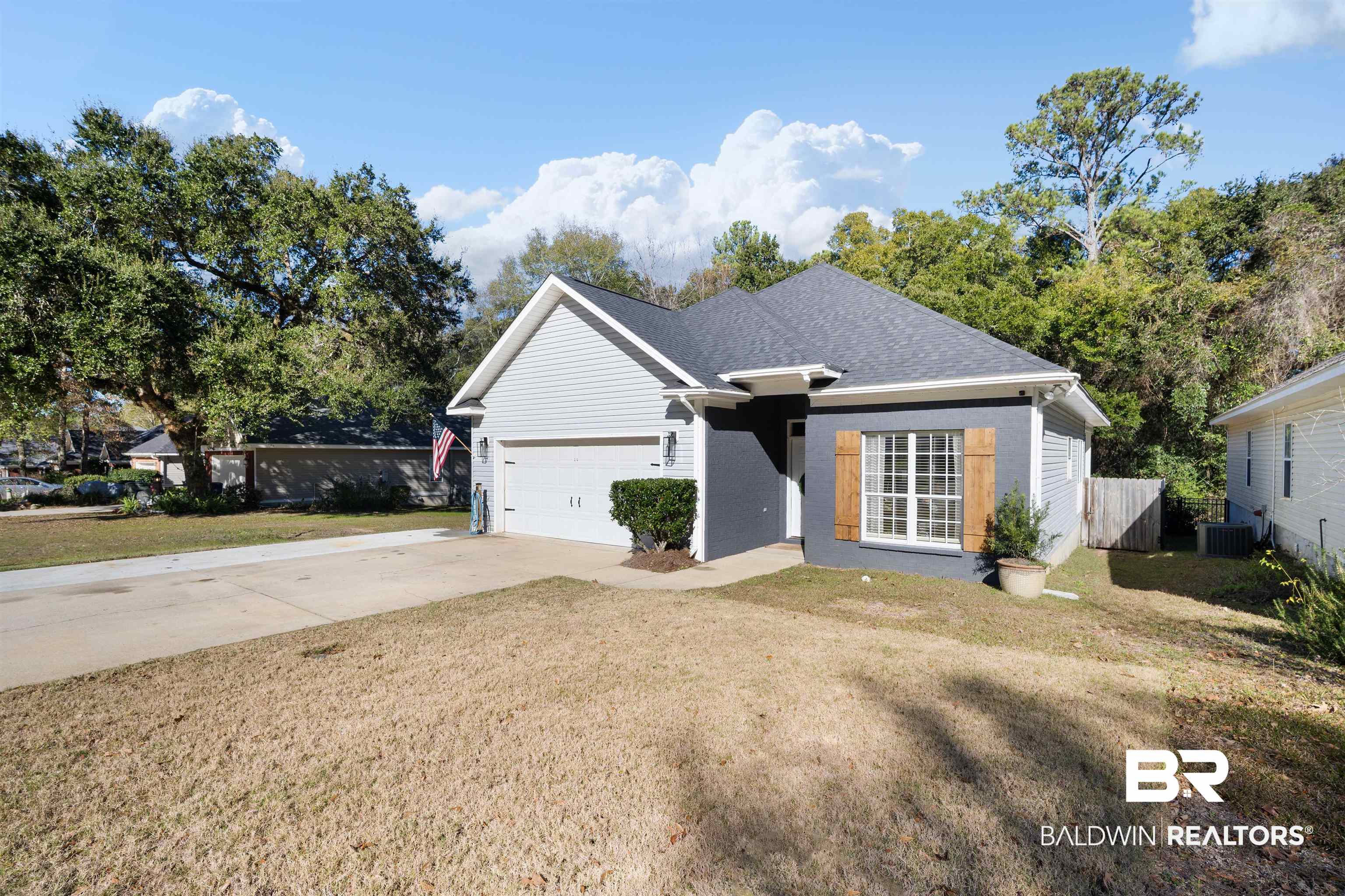 27288 Parker Lane Daphne, AL 36526 - Photo 27 of 29 Ranch-style house with concrete driveway, brick siding, a garage, and roof with shingles