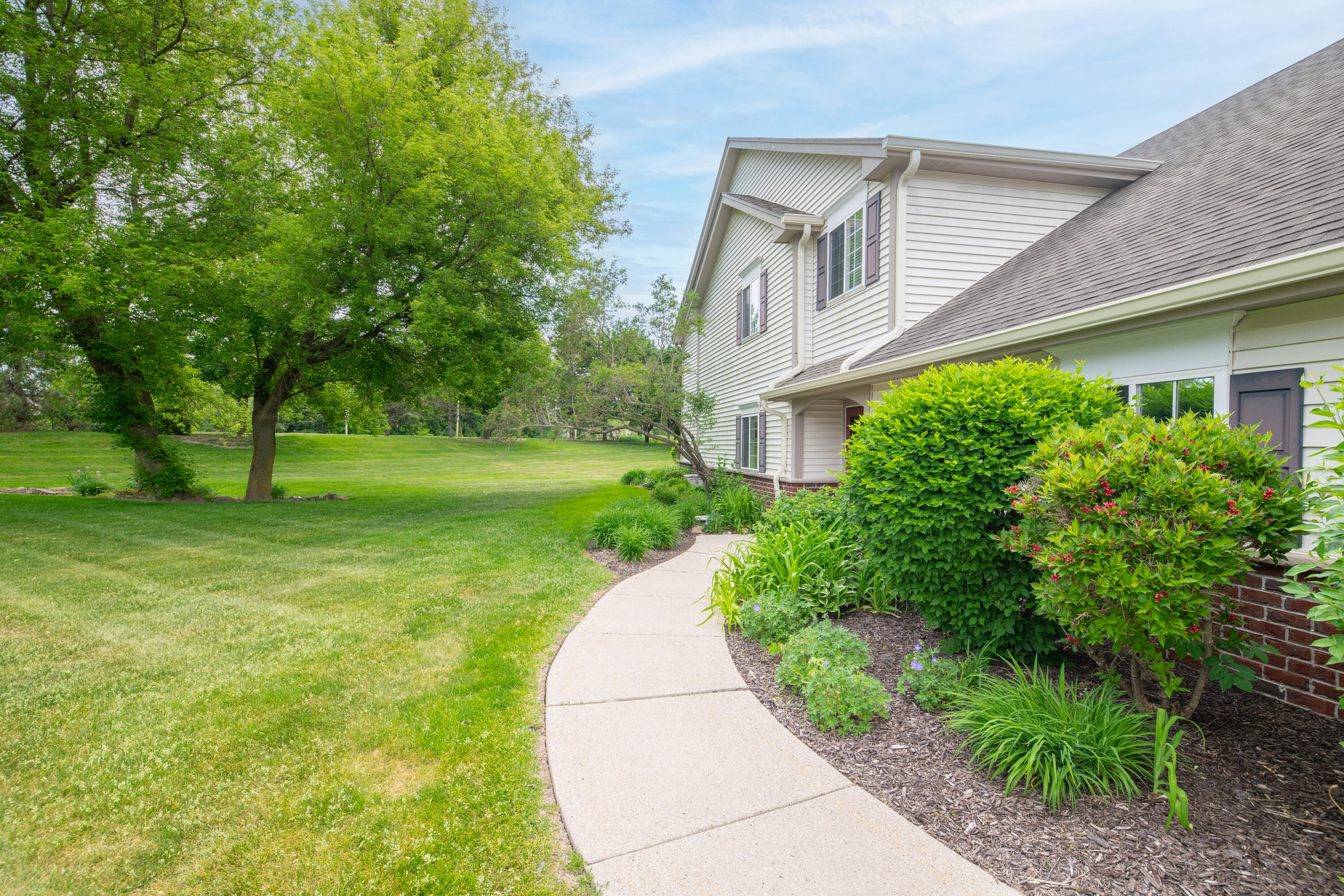 652 Pewaukee Road, Unit A Pewaukee, WI 53072 - Photo 24 of 30 Nice landscaping at entry