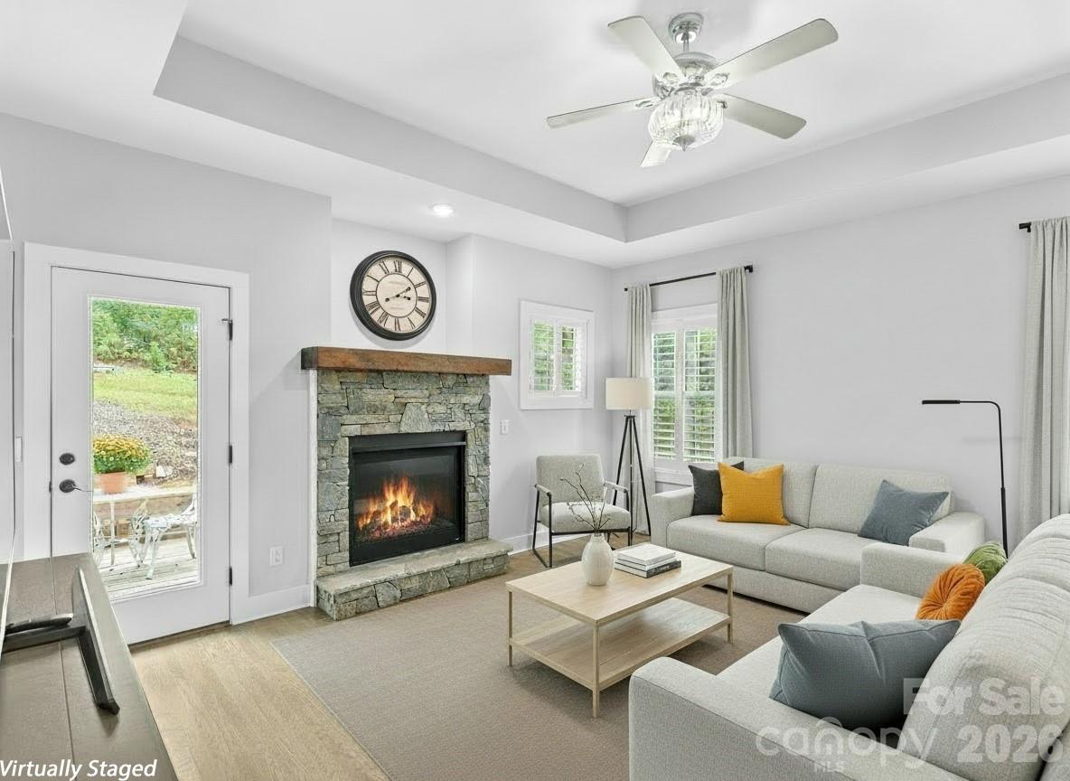 139 Clay Street Fairview, NC 28730 - Photo 15 of 35 a living room with furniture and a fireplace