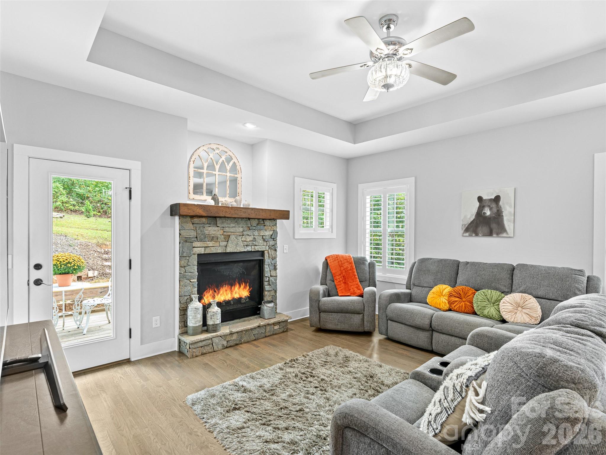 139 Clay Street Fairview, NC 28730 - Photo 16 of 35 a living room with furniture and a fireplace