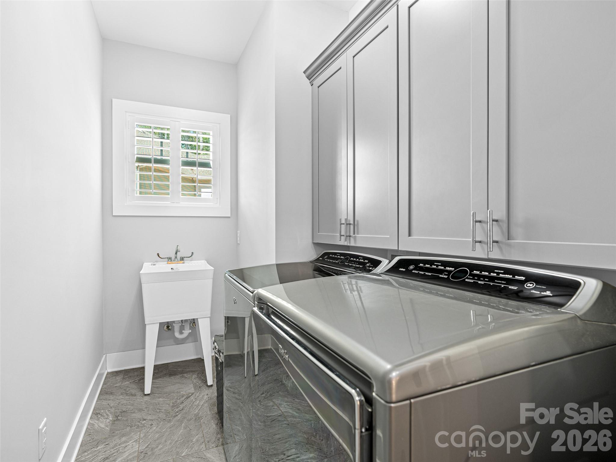 139 Clay Street Fairview, NC 28730 - Photo 19 of 35 a room with a table chairs and a window
