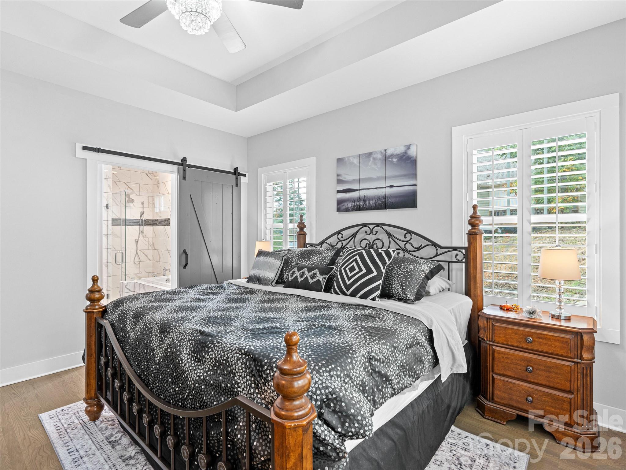 139 Clay Street Fairview, NC 28730 - Photo 22 of 35 a bedroom with a bed and window