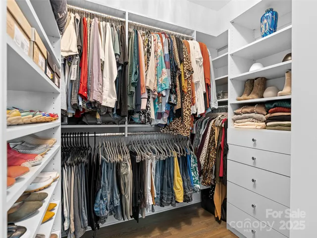 a en suite bathroom with a granite countertop sink and a mirror