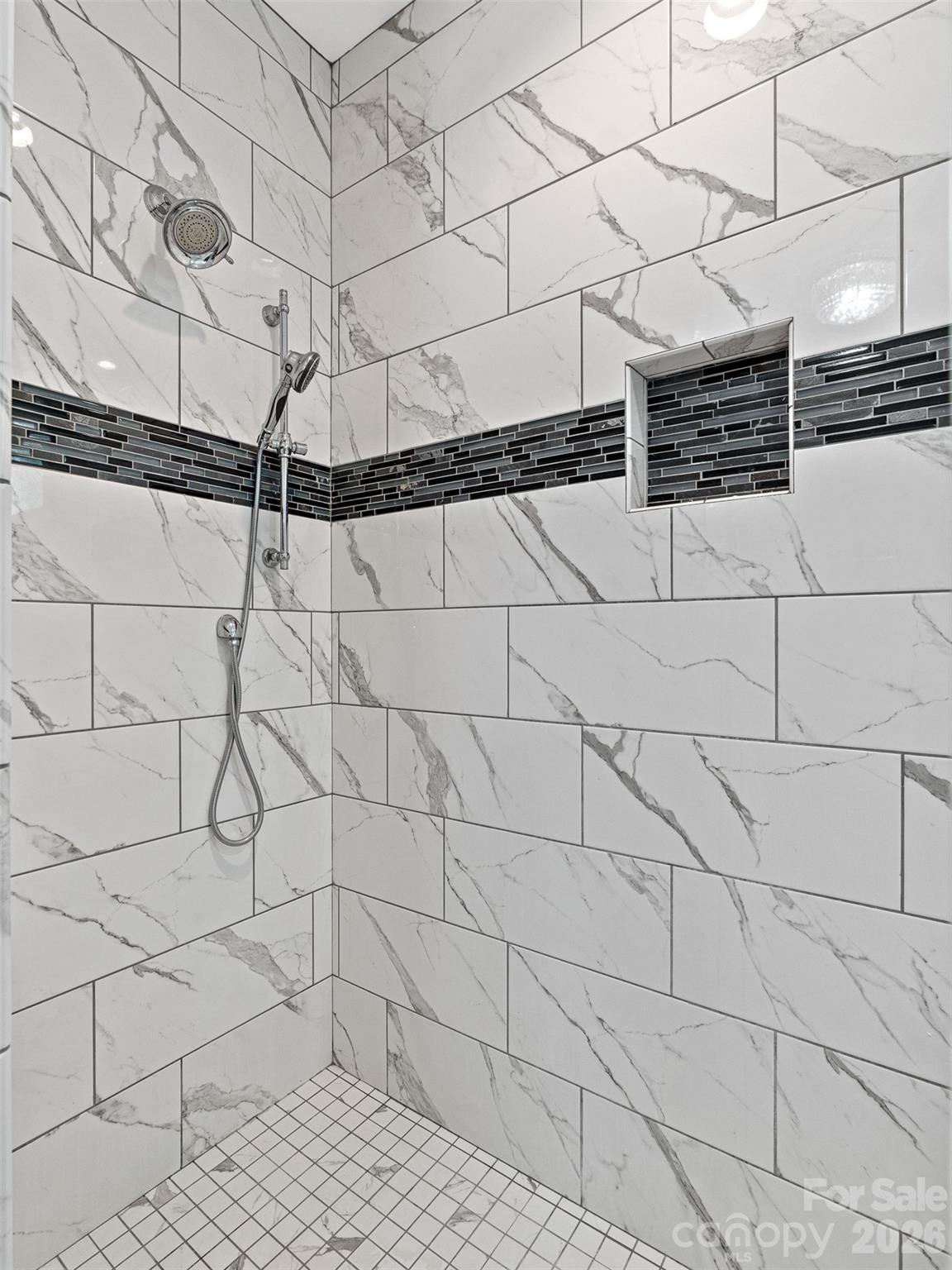 139 Clay Street Fairview, NC 28730 - Photo 27 of 35 a dirty bathroom with white tiles