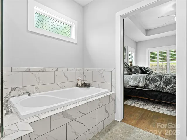 a dirty bathroom with white tiles