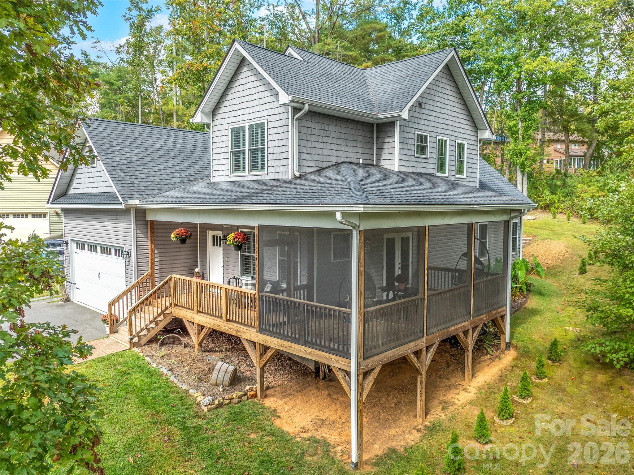 139 Clay Street Fairview, NC 28730 - Photo 3 of 35 a view of house with a yard and seating area