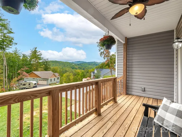 a view of a balcony with chairs