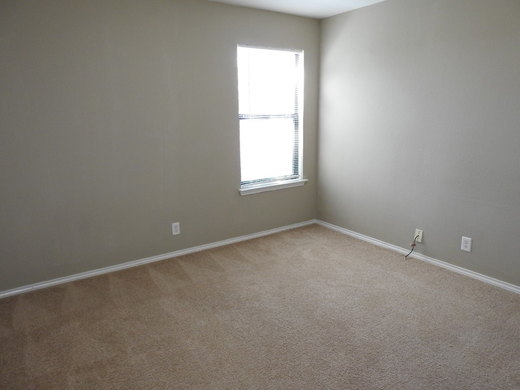 571 New Country Road Kyle, TX 78640 - Photo 15 of 21 an empty room with a window