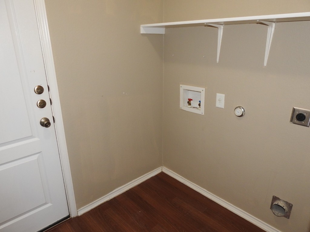 571 New Country Road Kyle, TX 78640 - Photo 20 of 21 a view of a room with wooden floor