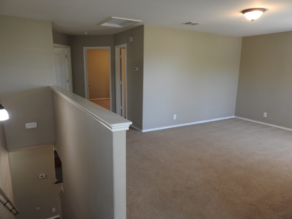 571 New Country Road Kyle, TX 78640 - Photo 8 of 21 a view of an empty room