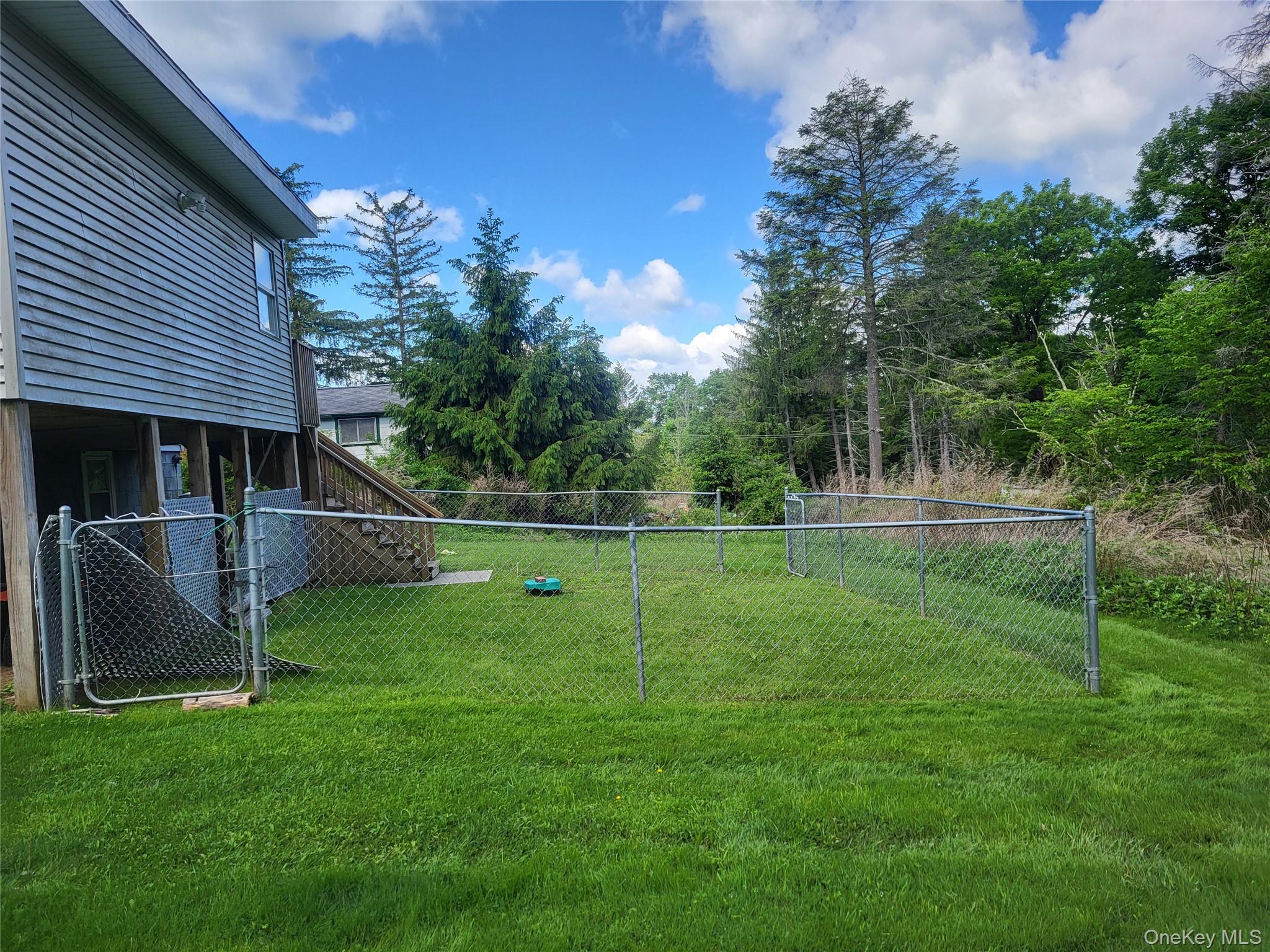 286 Dingle Daisy Road Monticello, NY 12701 - Photo 27 of 35 a view of a house with a backyard