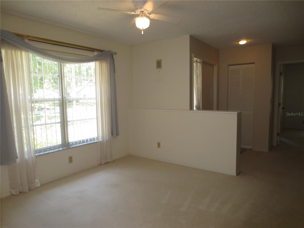 3235 East Dorchester Drive Palm Harbor, FL 34684 - Photo 14 of 47 a view of an empty room with a window