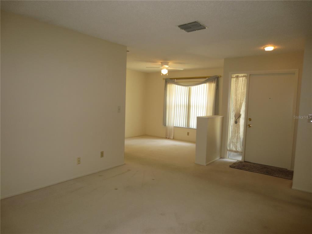 3235 East Dorchester Drive Palm Harbor, FL 34684 - Photo 17 of 47 a view of an empty room with a window