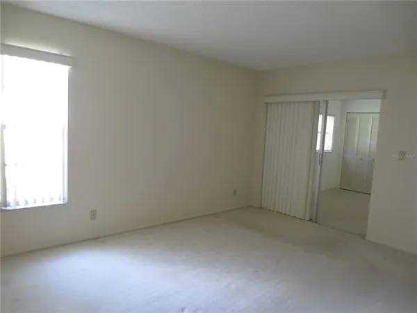 a kitchen with granite countertop a sink a counter top space appliances and cabinets