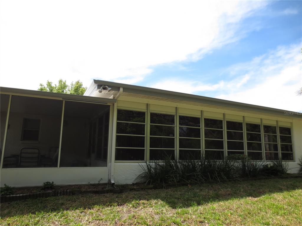 3235 East Dorchester Drive Palm Harbor, FL 34684 - Photo 20 of 47 a view of a house with a yard