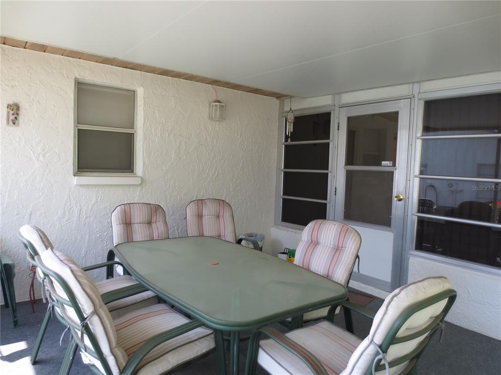 3235 East Dorchester Drive Palm Harbor, FL 34684 - Photo 22 of 47 a view of a dining room with furniture