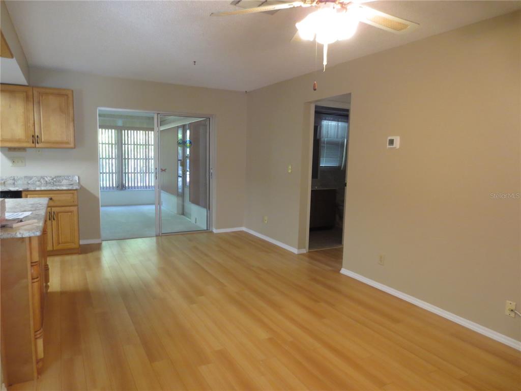 3235 East Dorchester Drive Palm Harbor, FL 34684 - Photo 37 of 47 wooden floor in an empty room with a window