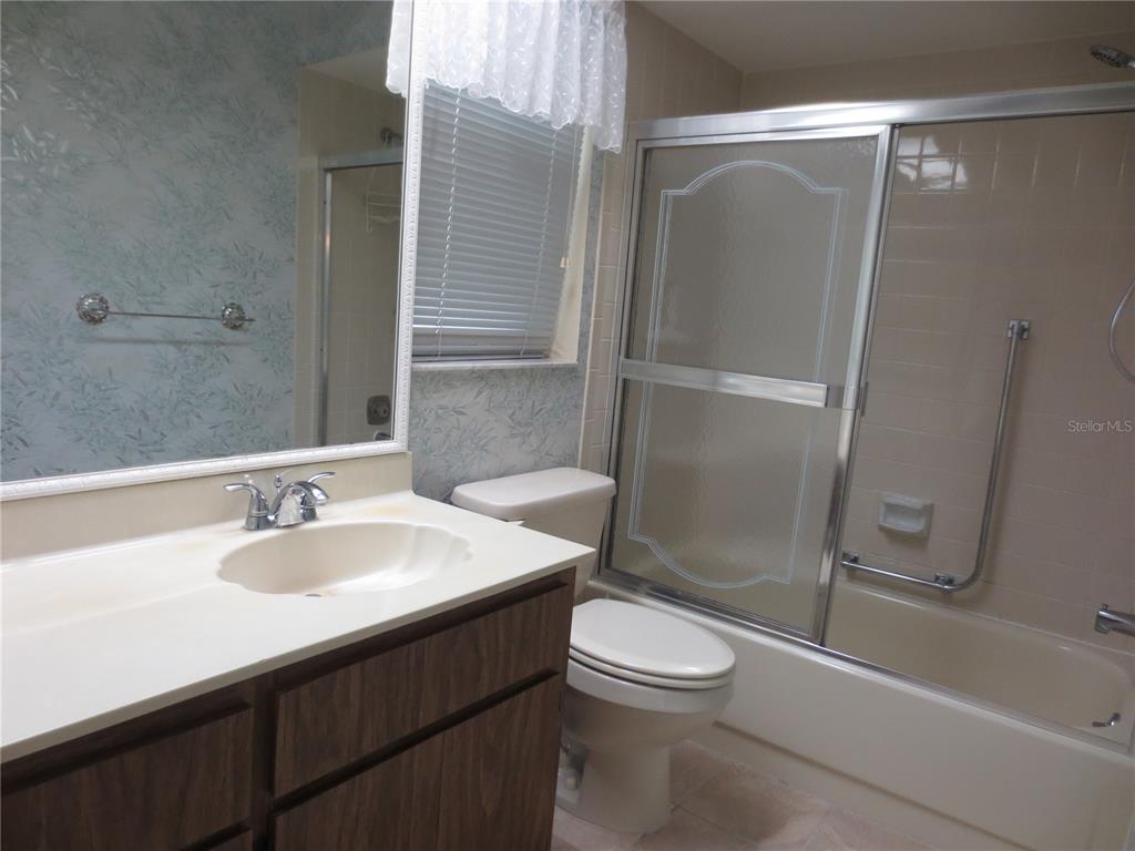 3235 East Dorchester Drive Palm Harbor, FL 34684 - Photo 38 of 47 a bathroom with a sink a toilet and shower