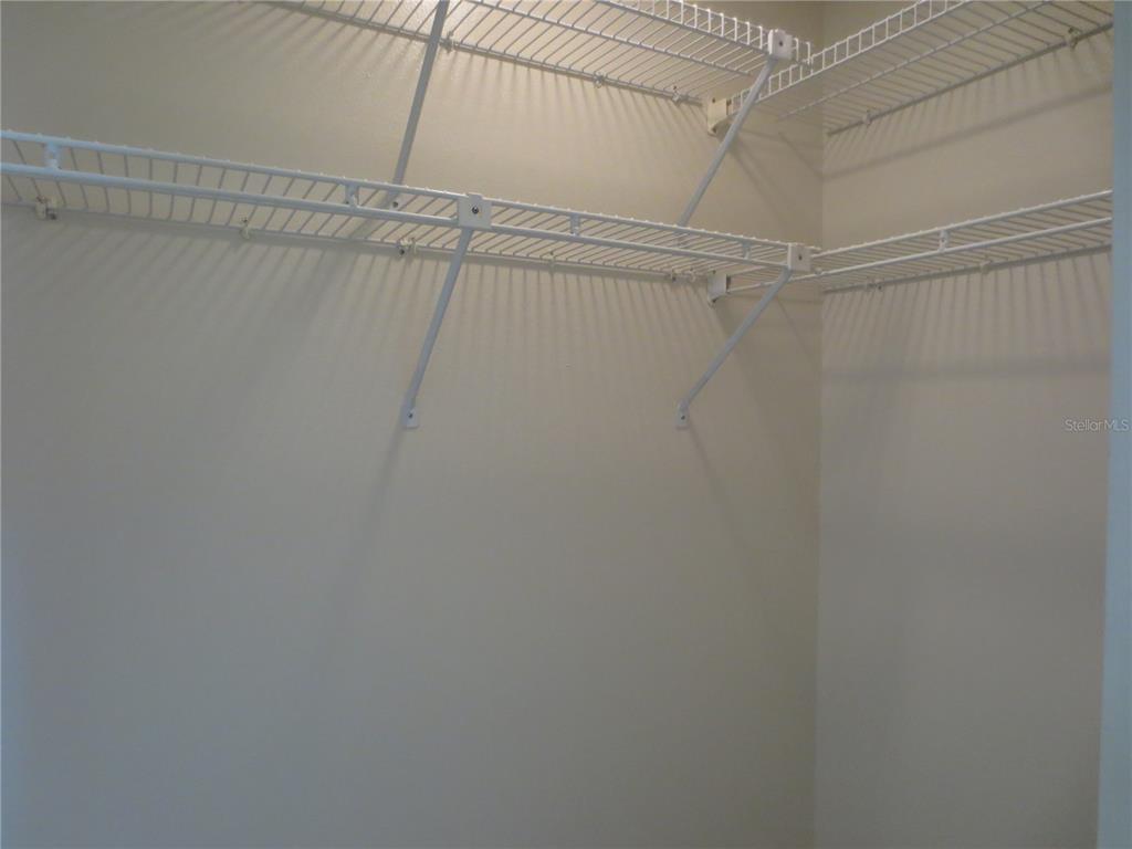 3235 East Dorchester Drive Palm Harbor, FL 34684 - Photo 42 of 47 a view of a room with racks on the wall