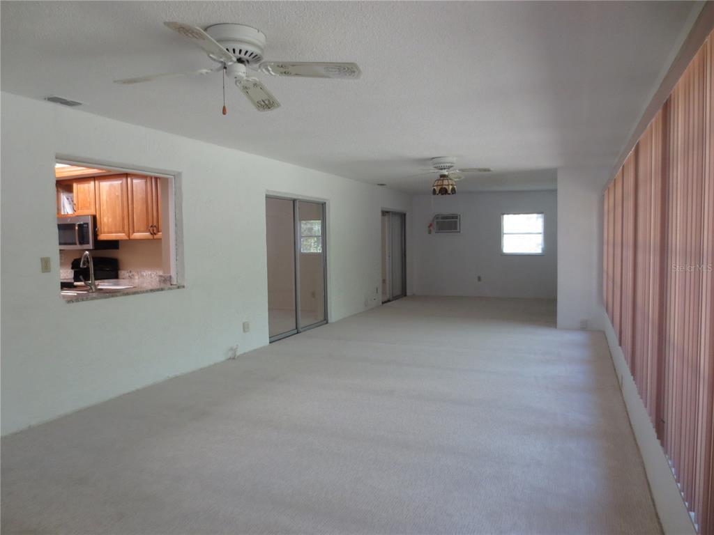 3235 East Dorchester Drive Palm Harbor, FL 34684 - Photo 45 of 47 a view of an empty room with a window