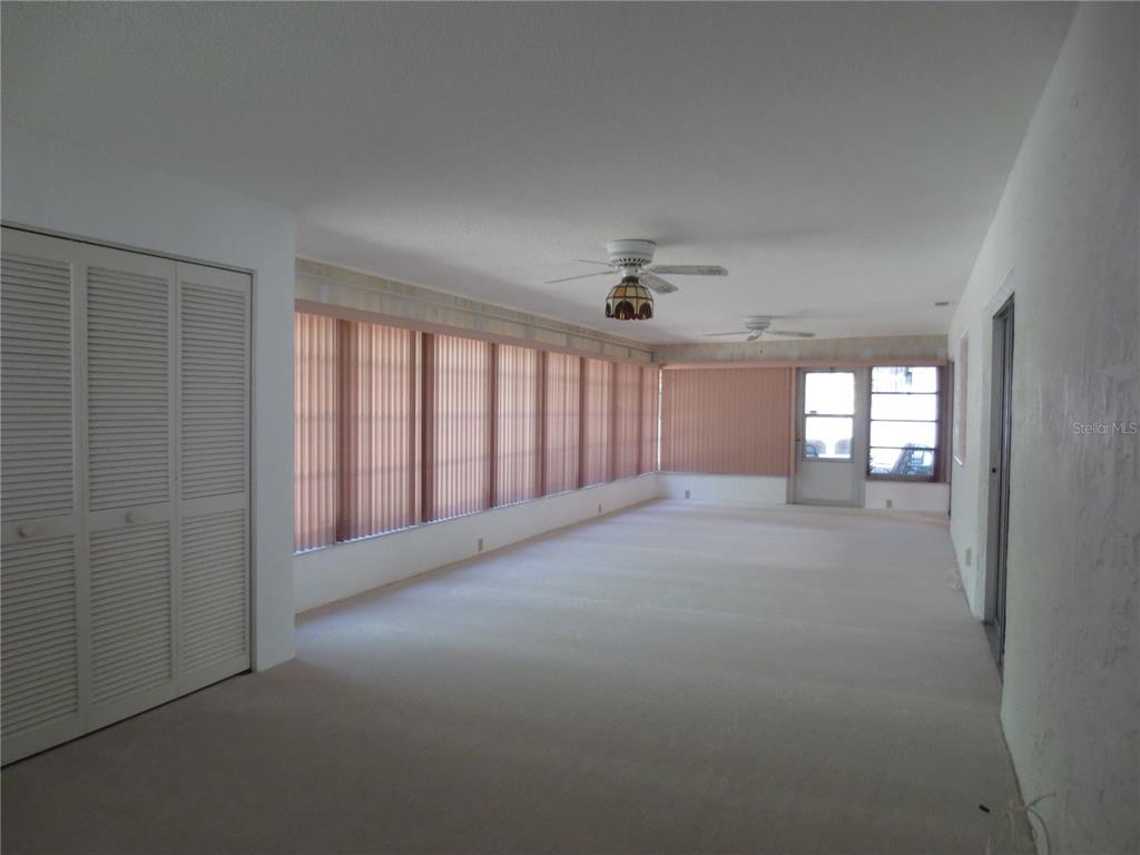 3235 East Dorchester Drive Palm Harbor, FL 34684 - Photo 47 of 47 a view of a room with windows and ceiling fan
