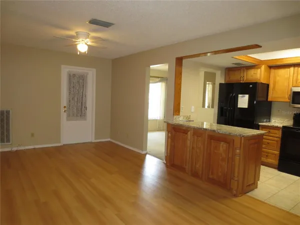 a kitchen with a refrigerator and a sink