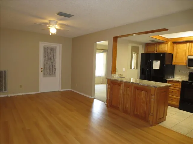 a kitchen with a refrigerator and a sink