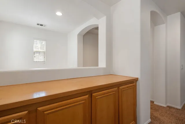 a room with a sink and cabinets
