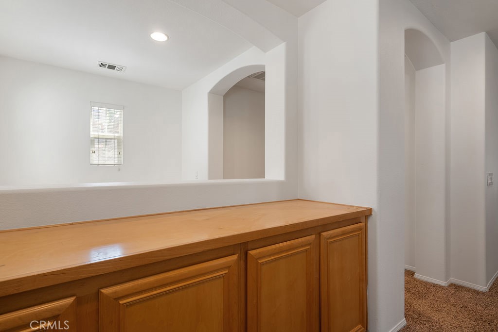 27635 Sienna Rdg Row Canyon Country, CA 91351 - Photo 15 of 30 a room with a sink and cabinets