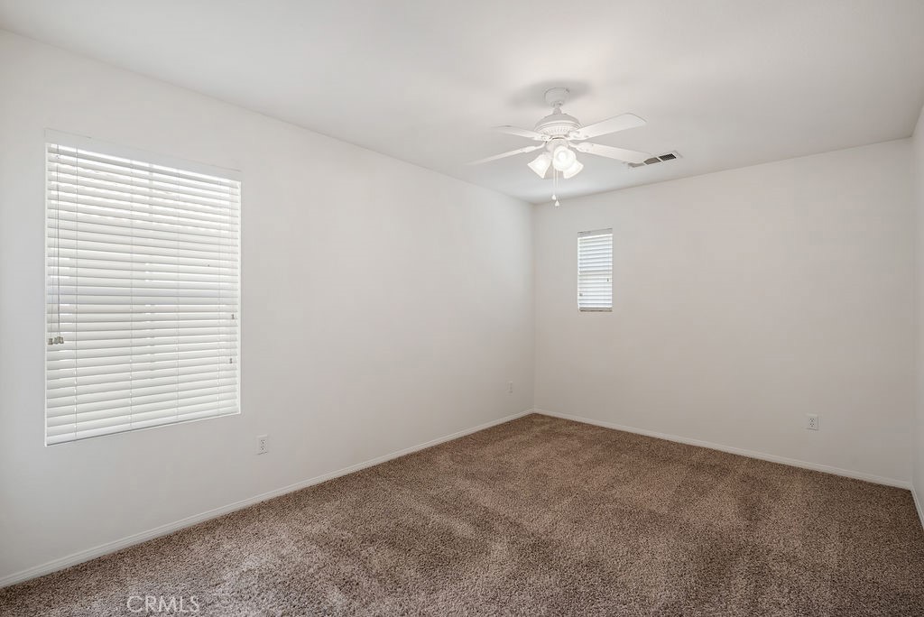 27635 Sienna Rdg Row Canyon Country, CA 91351 - Photo 17 of 30 an empty room with a window and ceiling fan