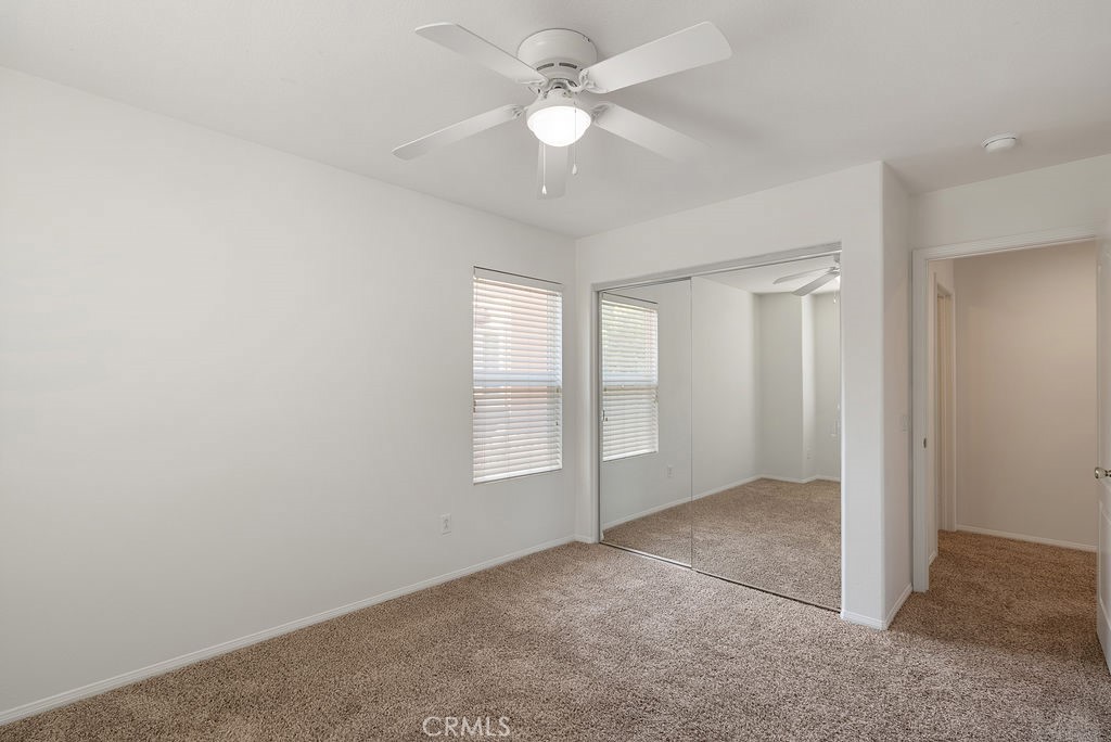 27635 Sienna Rdg Row Canyon Country, CA 91351 - Photo 21 of 30 an empty room with windows and ceiling fan