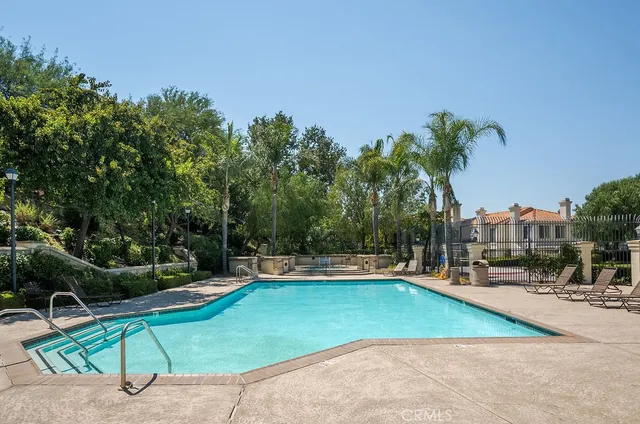 a view of a swimming pool with a patio