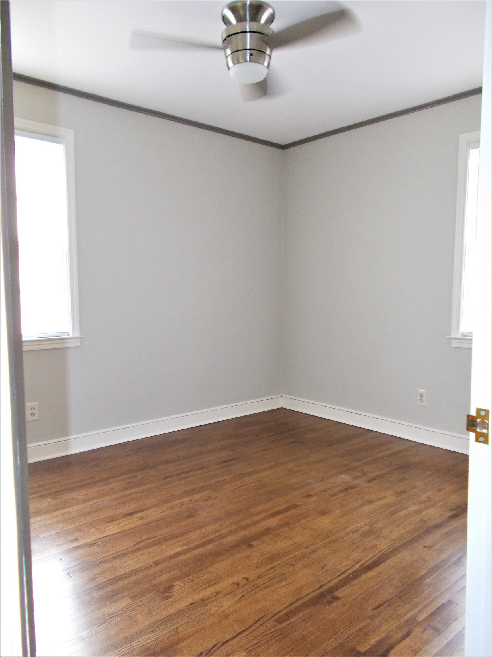 1061 Wingfield Road Memphis, TN 38122 - Photo 20 of 25 wooden floor in an empty room with a window