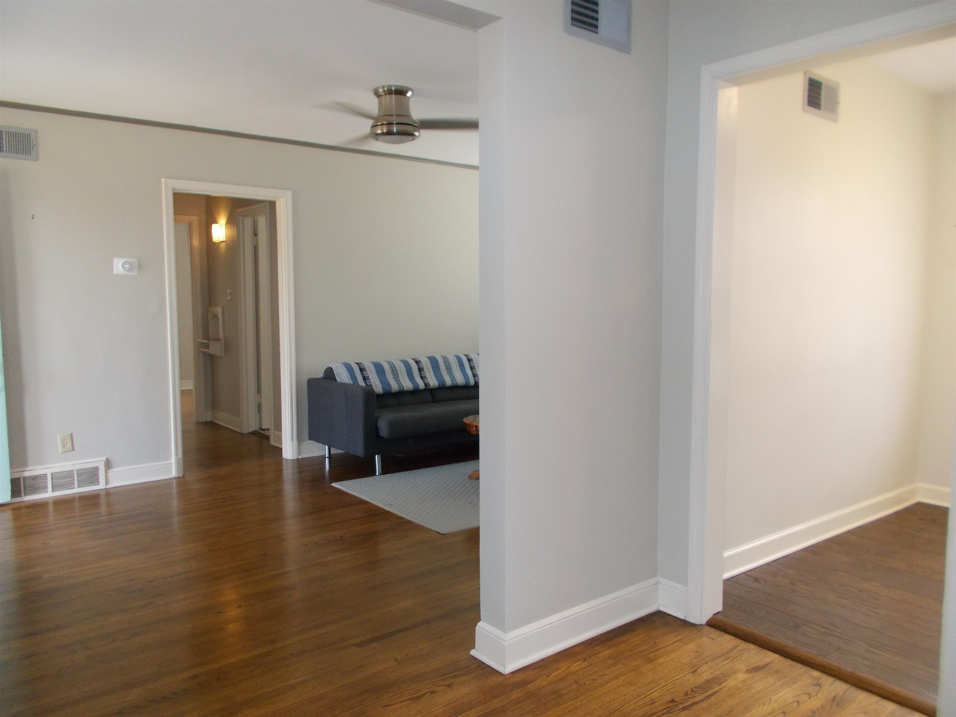 1061 Wingfield Road Memphis, TN 38122 - Photo 5 of 25 a view of a hallway with wooden floor and staircase