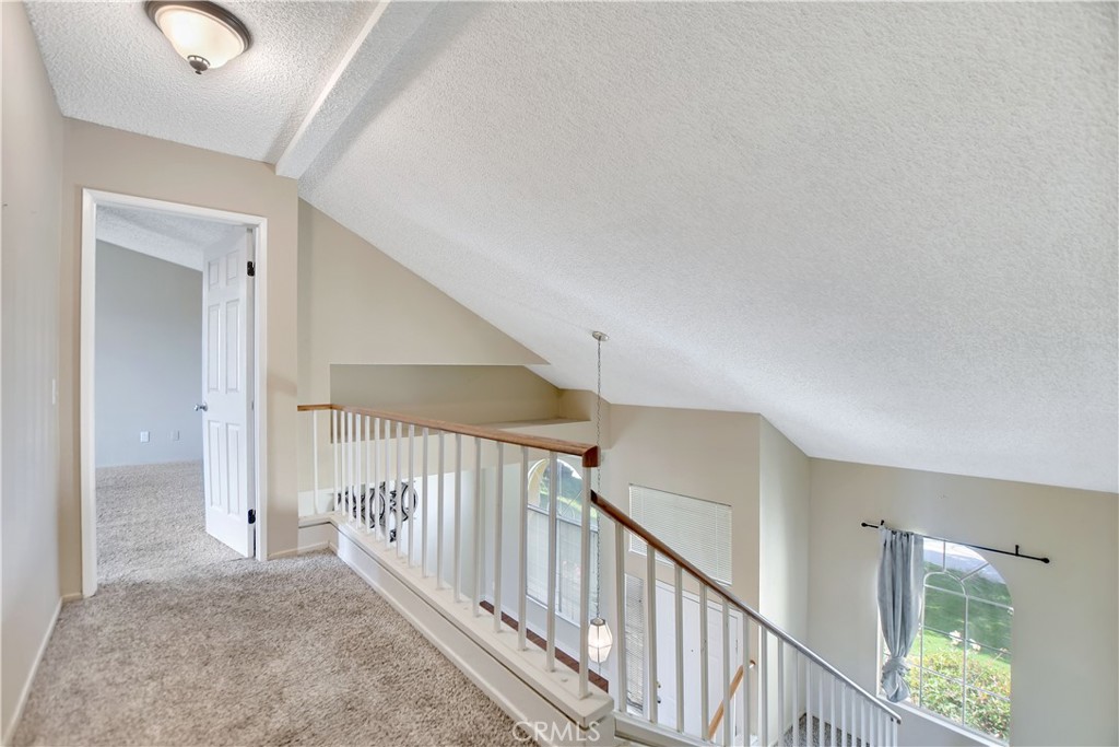 14527 Pony Trail Road Victorville, CA 92392 - Photo 10 of 21 a view of a hallway with staircase