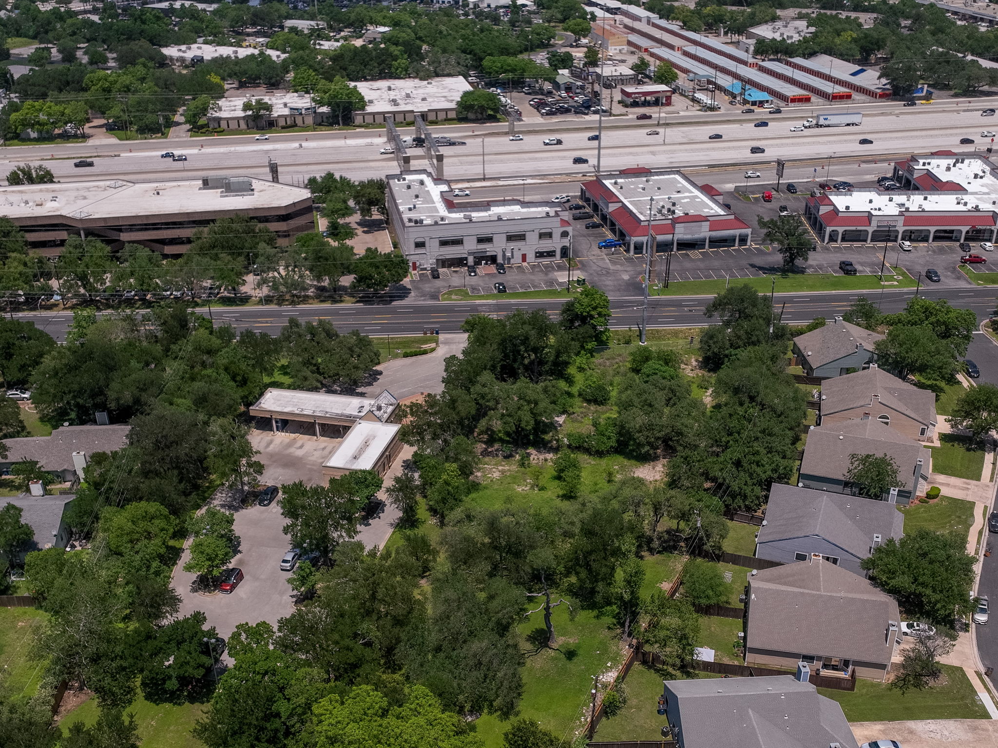 12182 Jollyville Road Austin, TX 78759 - Photo 24 of 25 Aerial depiction of a substantial land parcel featuring mature trees