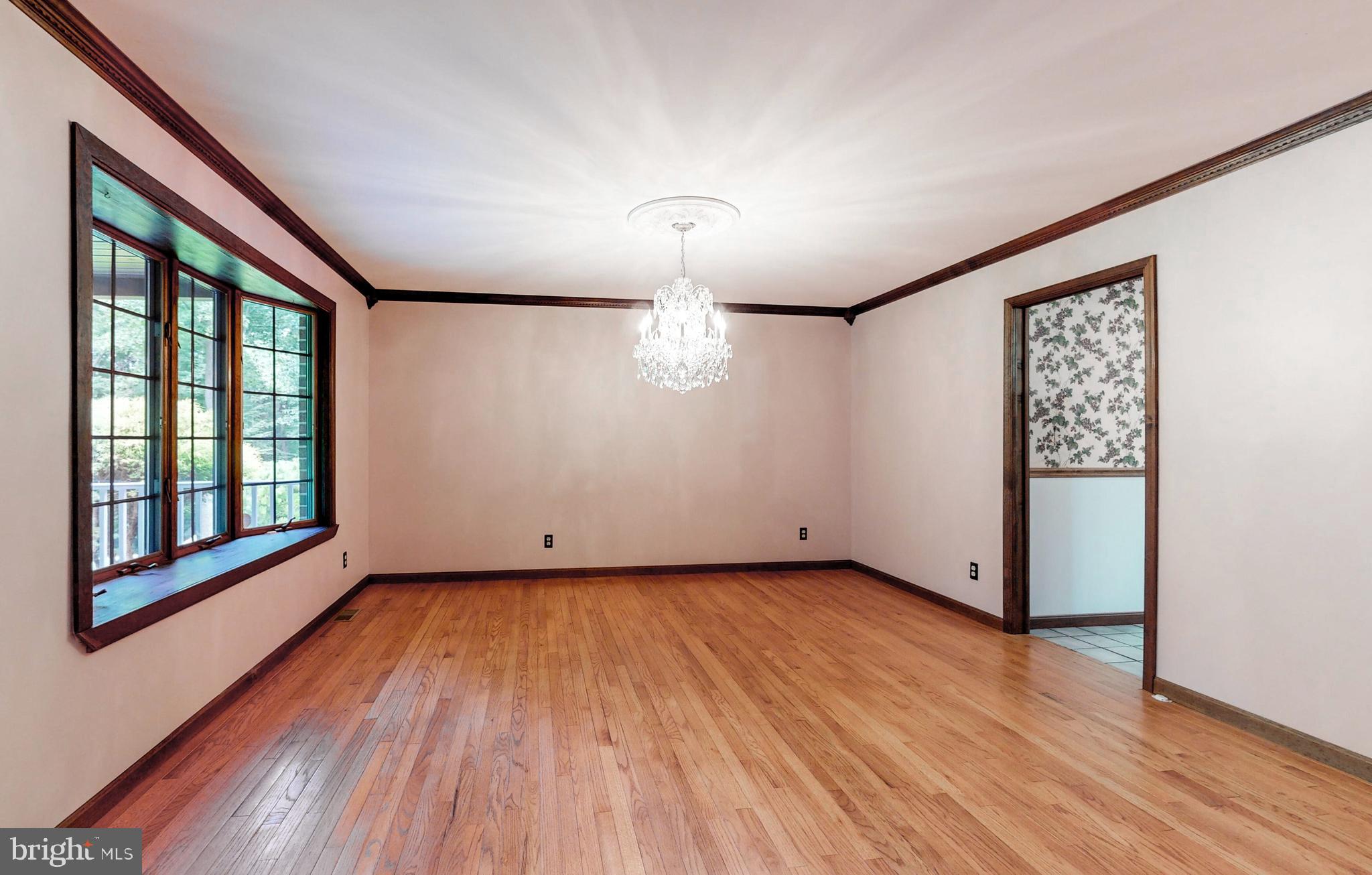 2021 Oakmont Road Fallston, MD 21047 - Photo 11 of 50 a view of an empty room with wooden floor and a window