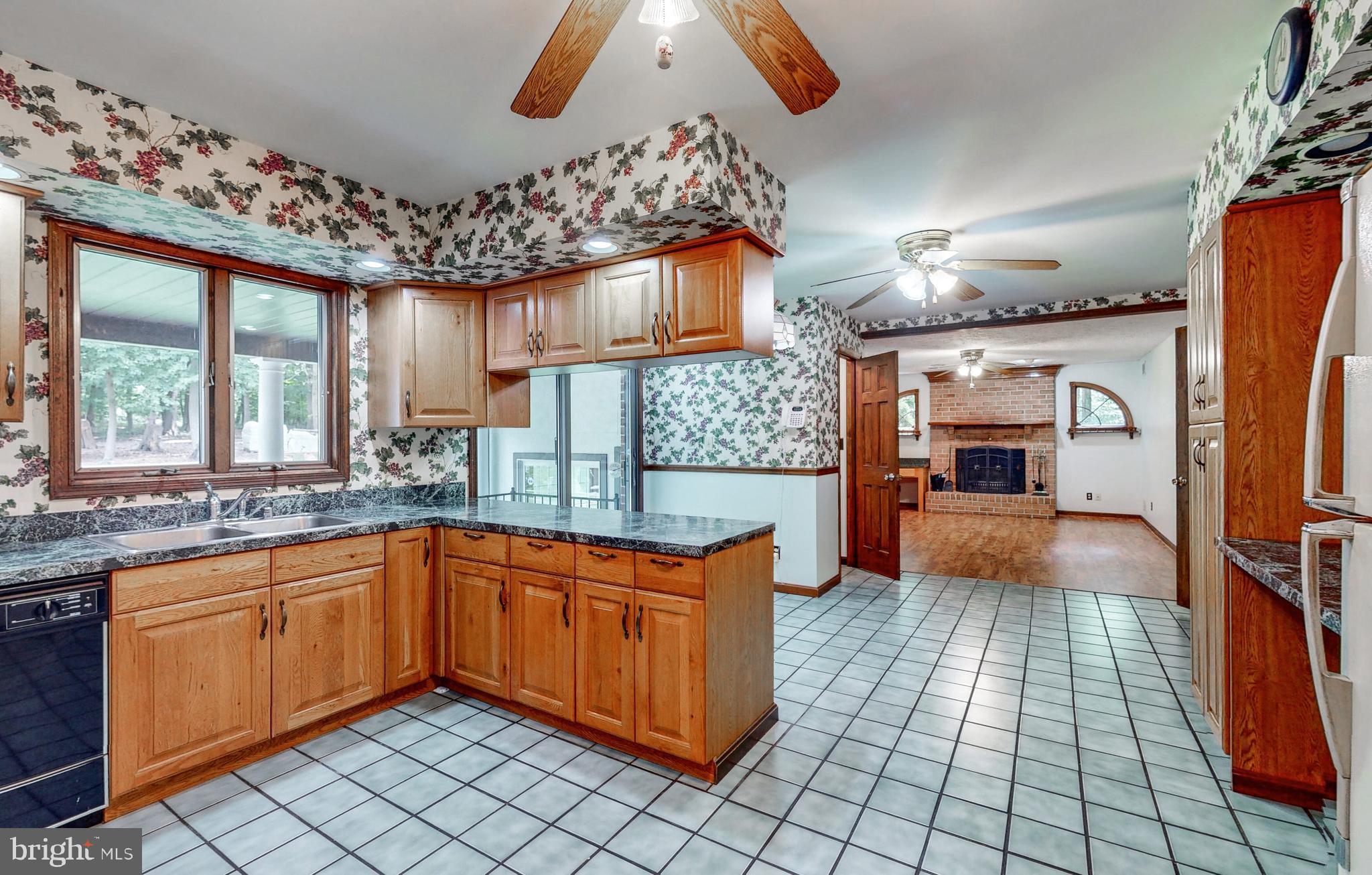 2021 Oakmont Road Fallston, MD 21047 - Photo 12 of 50 a kitchen with a sink stove and cabinets