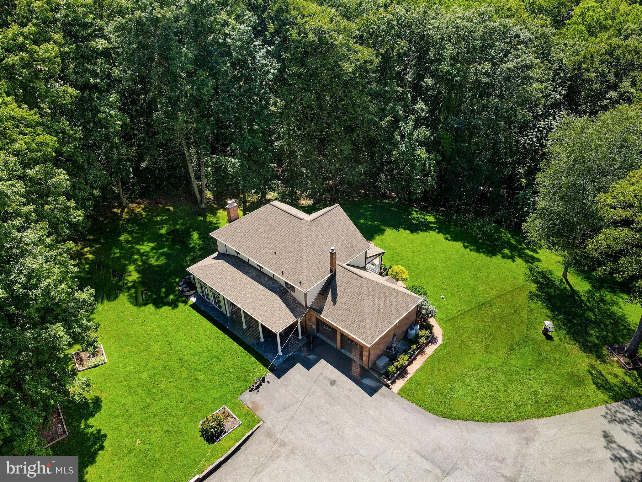 2021 Oakmont Road Fallston, MD 21047 - Photo 39 of 50 an aerial view of a house with garden space and trees