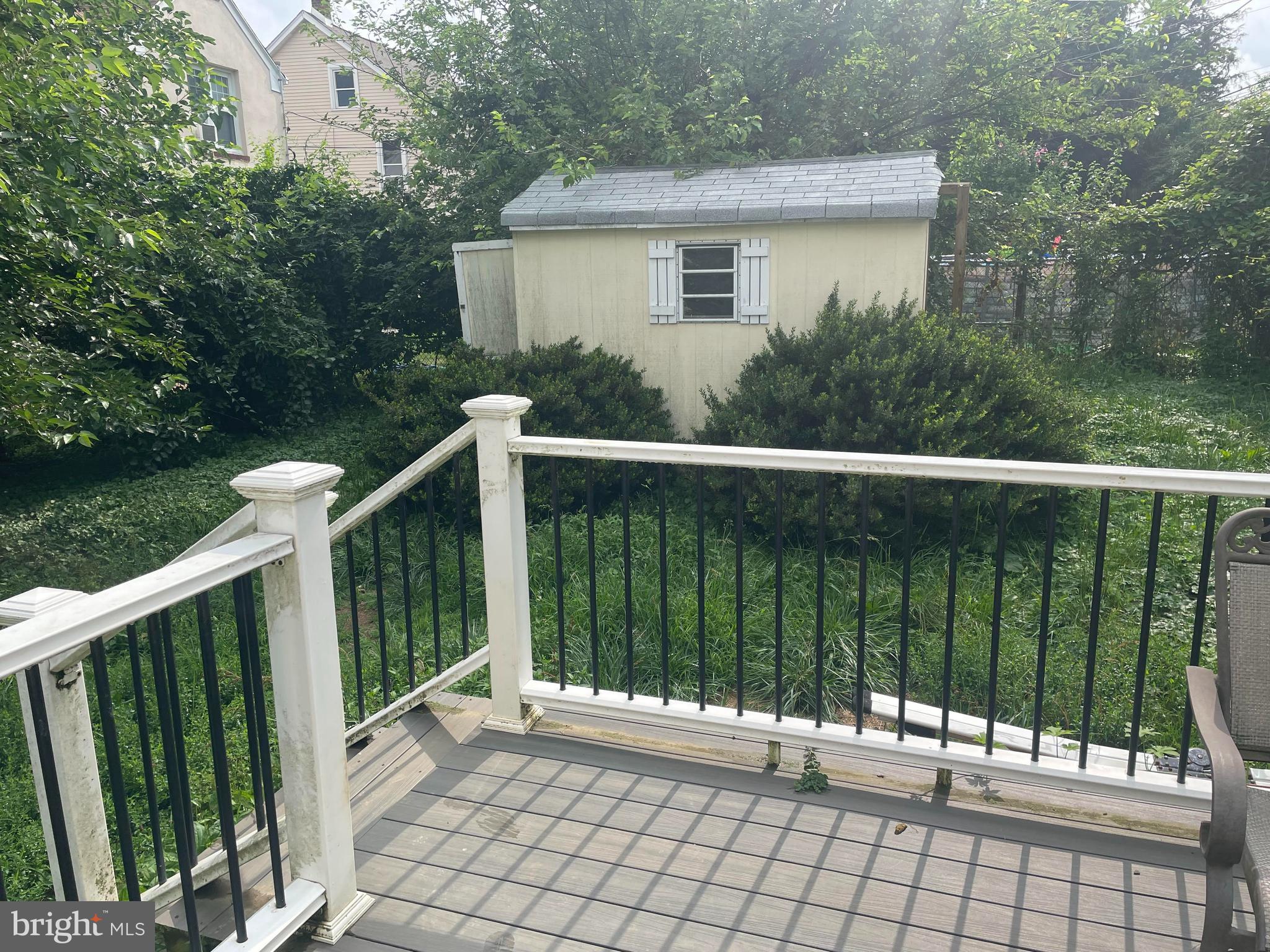 Deck looking out to shed in backyard